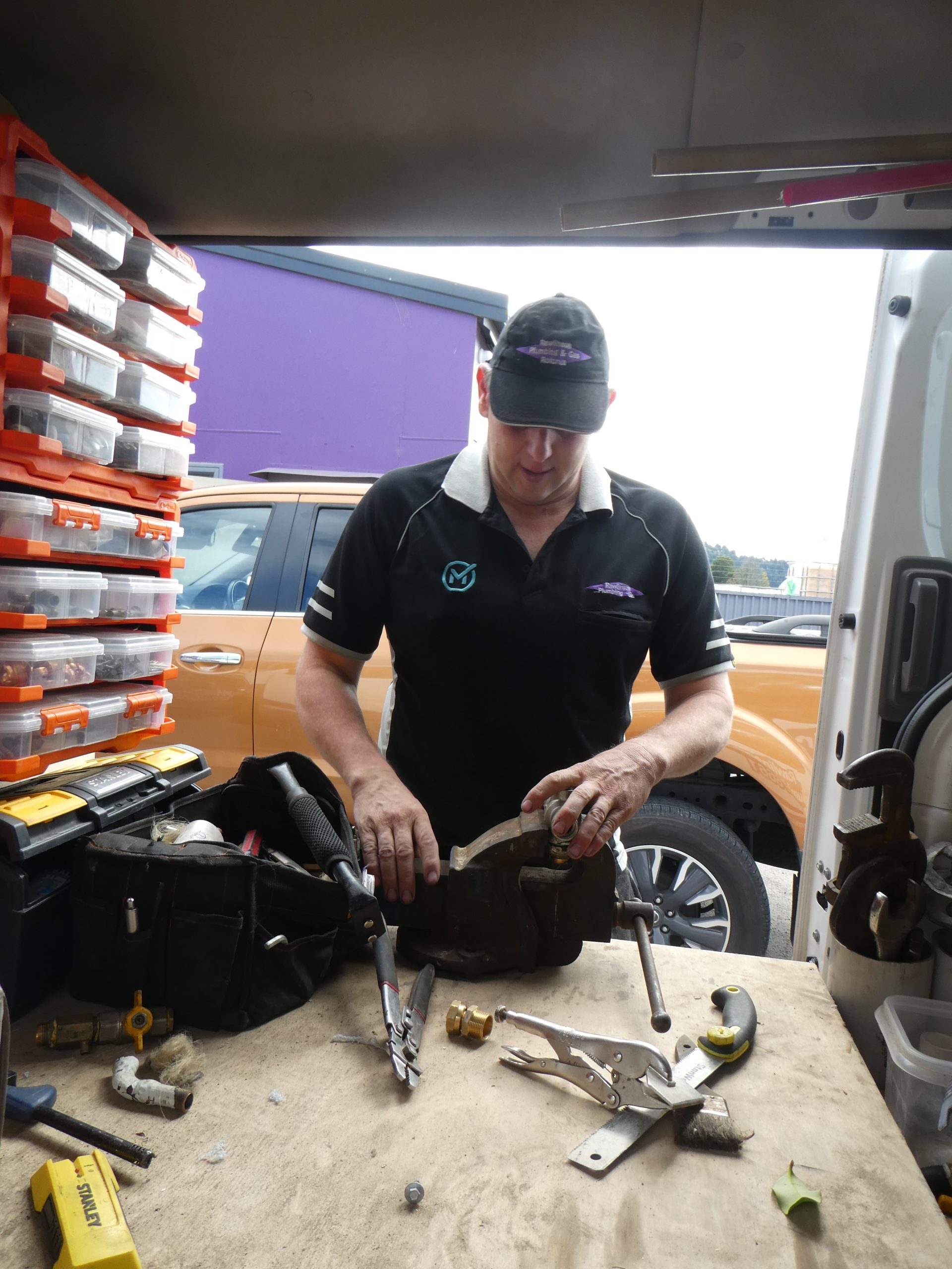 Rawlinson Plumbing & Gas plumber working with a tool set